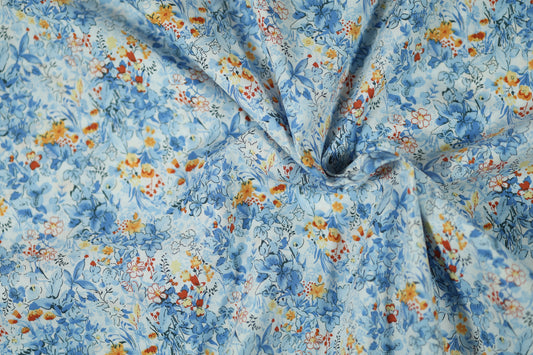 Hochwertiger Stretchstoff mit Blumenmuster in Himmelblau mit Orange – perfekt für Nähen und Design
