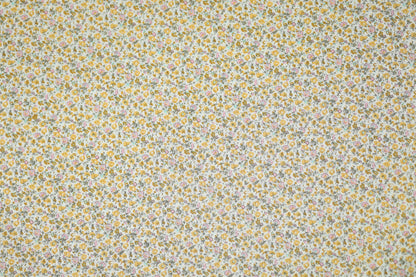 Floraler Baumwoll-Stretchstoff in Goldene Wiesenblumen – ideal für Bekleidung und kreative Projekte