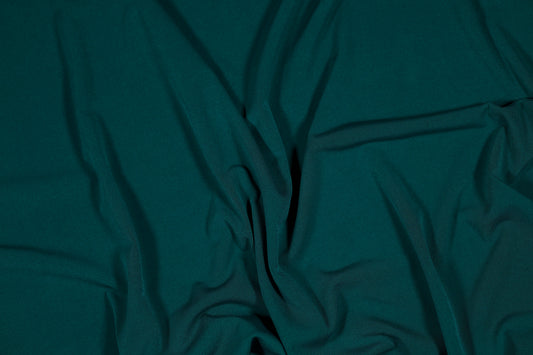 Eleganter Jerseystoff in tiefem Smaragdgrün, weich drapiert