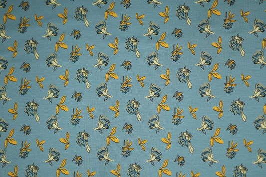 Gelbe Blätter auf Himmelblau – hochwertiger Baumwollstoff für Kinder und kreative Projekte.