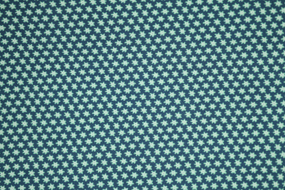 Kleine Blüten auf Marineblau – hochwertiger Baumwollstoff für Kinder und kreative Projekte.