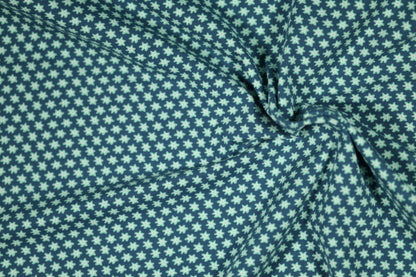 Baumwollstoff mit Motiv: kleine blüten auf marineblau – weich & kindgerecht.